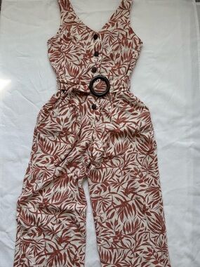 Sleeveless V-Neck Belted Jumpsuit in Rust Leaf Print